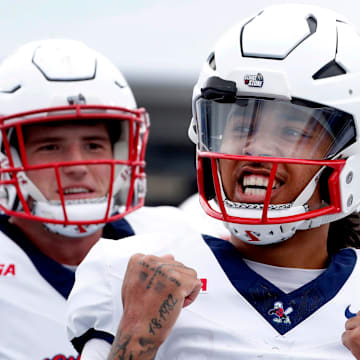Liberty quarterback Kaidon Salter (7) celebrates his touchdown against Middle Tennessee during the Salute to Veterans & Armed Forces game at MTSU on Saturday, Nov. 9, 2024.