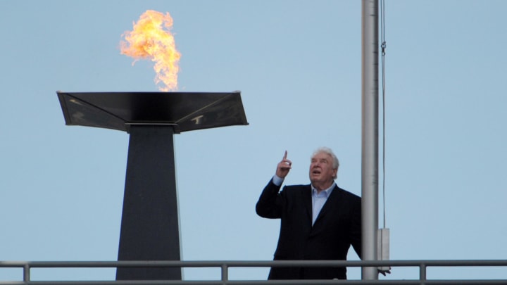 Oct 16, 2011; Oakland, CA, USA; Oakland Raiders former coach John Madden lights a torch in the memory of owner Al Davis (not pictured) during halftime ceremony of the game against the Cleveland Browns at the O.co Coliseum. Mandatory Credit: Kirby Lee/Image of Sport-USA TODAY Sports