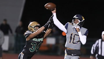 Warren quarterback Madden Iamaleava is under pressure by St. Bonaventure's Jacob Moraga as he fires a pass during the first quarter of the Seraphs' 24-21 win in the CIF-SS Division 3 championship game on Saturday, Nov. 25, 2023, at Ventura High's Larrabee Stadium.