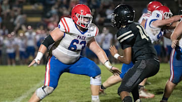 Grant Wise (63) gets set to engage with Saleem Mickles (44) during the Pace vs Milton football game