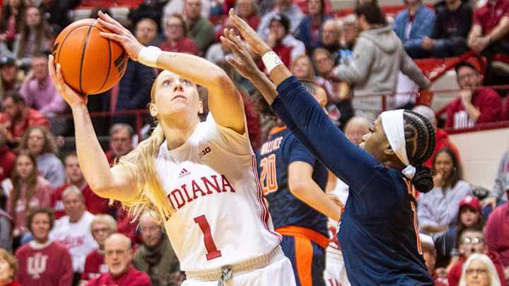 Indiana's Lexus Bargesser (1) shoots over Illinois' Genesis Bryant (1) and Kendall Bostic (44) during the Indiana versus Illinois women's basketball game at Simon Skjodt Assembly Hall on Thursday, Jan. 16, 2025. Indiana's Lexus Bargesser (1) shoots over Illinois' Genesis Bryant (1) and Kendall Bostic (44) during the Indiana versus Illinois women's basketball game at Simon Skjodt Assembly Hall on Thursday, Jan. 16, 2025.