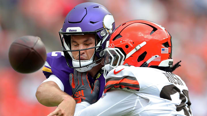 Minnesota Vikings quarterback Nick Mullens takes a hit while throwing from Cleveland Browns linebacker Devin Bush. Minnesota Vikings quarterback Nick Mullens takes a hit while throwing from Cleveland Browns linebacker Devin Bush.