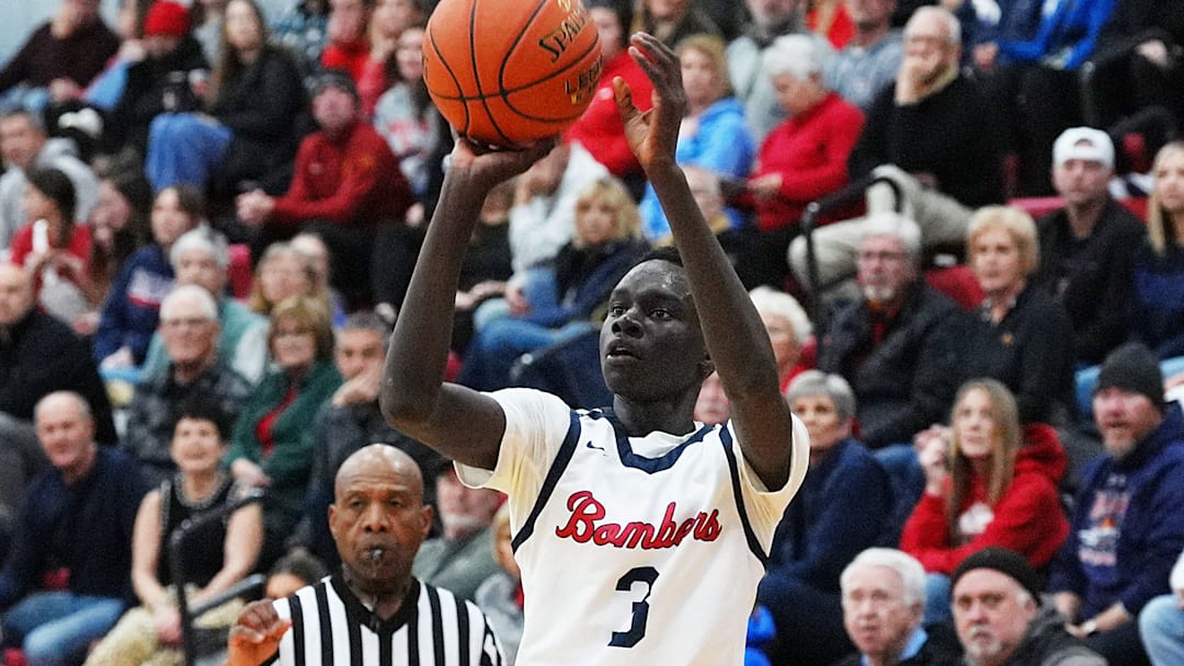 Ballard Mojoe Nybong (3) takes a three-point shot against North Polk during the first quarter in the boys basketball on Dec. 12, 2025, at Ballard High School gym in Huxley Iowa.