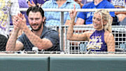 LSU Tiger alumni Paul Skenes and Livvy Dunne watch action against the UCLA Bruinsat Charles Schwab Field.