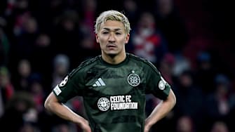 Celtic forward Daizen Maeda stands on the pitch during UCL second leg knock-out playoff match against Bayern Munich. 