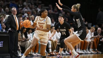 Mar 29, 2024; Portland, OR, USA; Texas Longhorns forward Madison Booker (35) looks to pass during the second half against Gonzaga Bulldogs guard Esther Little (0) and guard Kaylynne Truong (14) in the semifinals of the Portland Regional of the 2024 NCAA Tournament at the Moda Center at the Moda Center. Mandatory Credit: Troy Wayrynen-USA TODAY Sports