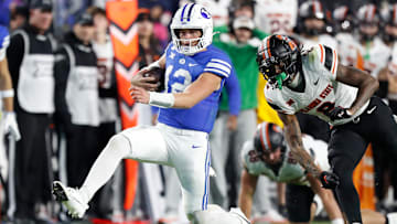 Jake Retzlaff escaped the Oklahoma State defense with his legs to keep the Cougars alive in their late-night victory.