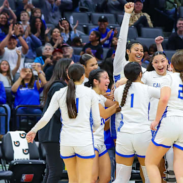 Caruthers players celebrate winning the California (CIF) State Division 2 championship at the Golden 1 Center in Sacramento.