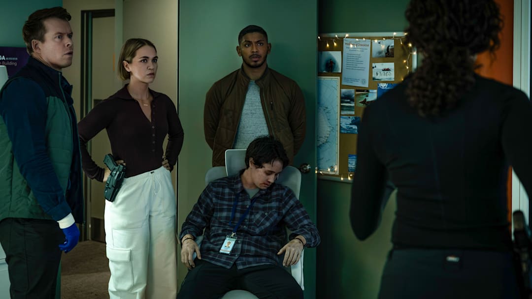 “South of Nowhere” – L-R: Todd Lasance as AFP Liaison Officer Sergeant Jim 'JD' Dempsey, Tuuli Narkle as AFP Liaison Officer Constable Evie Cooper, Sean Sagar as NCIS Special Agent DeShawn Jackson and Jasmine Smith-Sua as Dr. Diane Cohen in NCIS: Sydney episode 9, season 3 streaming on Paramount+, 2025. Photo Credit: Daniel Asher Smith/Paramount+ © TM & © 2025 CBS Studios Inc. NCIS: Sydney and related marks and logos are trademarks of CBS Studios Inc. All Rights Reserved.