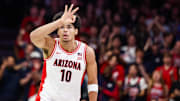 Nov 11, 2025; Tucson, Arizona, USA;  Arizona Wildcats forward Koa Peat (10) scores a three pointer during the first half of the game against the Northern Arizona Lumberjacks at McKale Memorial Center.