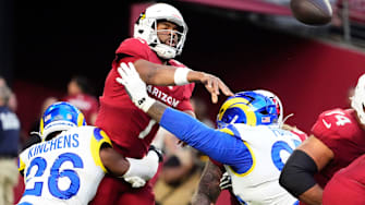 Los Angeles Rams safety Kamren Kinchens (26) pressures the pass by Arizona Cardinals quarterback Jacoby Brissett (7) in the second half at State Farm Stadium on Dec 7, 2025, in Glendale, Ariz.