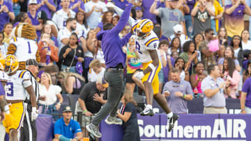 LSU WR Malik Nabers 8 celebrates with Receivers Coach Cortez Hankton after a touchdown as the LSU Tigers take on the Auburn Tigers at Tiger Stadium in Baton Rouge, Louisiana, Saturday, Oct. 14, 2023.