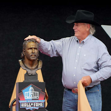 Hall of Famer Jared Allen with his presenter and father, Ronald Allen, unveil his bust during the Pro Football Hall of Fame Enshrinement, Aug. 2, 2025, in Canton.