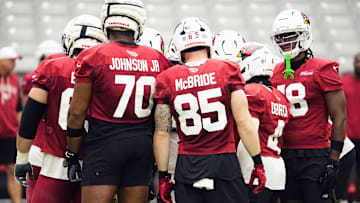 Arizona Cardinals offensive linemen Paris Johnson Jr. (70), tight end Trey McBride (85), and wide receiver Marvin Harrison Jr. (18) during training camp at State Farm Stadium in Glendale on July 25, 2025.
