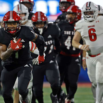 Imhotep Charter running back breaks away from the defense in the 2023 PIAA Class 5A state championship game against Peters Township. 