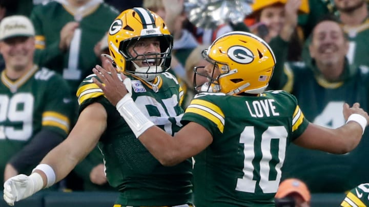 Green Bay Packers tight end Tucker Kraft (85) and quarterback Jordan Love (10) celebrate a fourth-quarter touchdown against the Cincinnati Bengals on Sunday, October 12, 2025, at Lambeau Field in Green Bay, Wis.