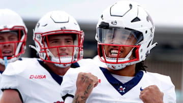 Liberty quarterback Kaidon Salter (7) celebrates his touchdown against Middle Tennessee during the Salute to Veterans & Armed Forces game at MTSU on Saturday, Nov. 9, 2024.