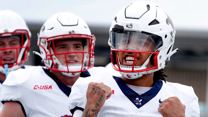 Liberty quarterback Kaidon Salter (7) celebrates his touchdown against Middle Tennessee during the Salute to Veterans & Armed Forces game at MTSU on Saturday, Nov. 9, 2024.