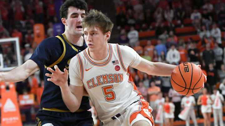 Feb 26, 2025; Clemson, South Carolina, USA; Clemson forward Asa Thomas (5) plays against Notre Dame during the second half at Littlejohn Coliseum. Mandatory Credit: Ken Ruinard-Imagn Images