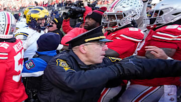 University of Michigan and Ohio State Police intervene as Michigan Wolverines and Ohio State Buckeyes fight following the NCAA football game at Ohio Stadium in Columbus on Saturday, Nov. 30, 2024. Michigan won 13-10.