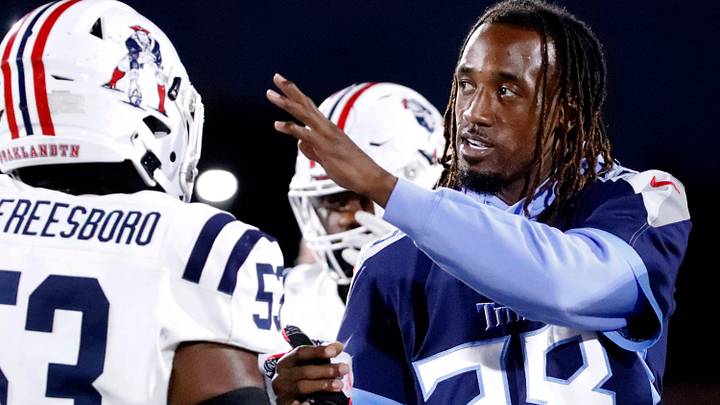 Tennessee Titan's player L'Jarius Sneed greets Oakland's Khameron Sanders (53) and other Oakland and Blackman players after the coin toss before the start of the football game between Blackman and Oakland at Blackman on Friday, Sept 26, 2025.