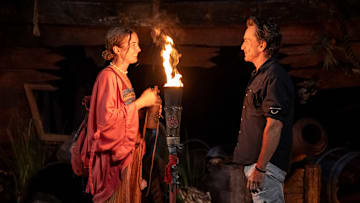 “The Devil’s Shoes” – A major shakeup hits the game when two tribes turn to three. New tribe members size each other up, but with only four players on each tribe, there is not much room to hide. Then, heat and exhaustion take a major toll on one castaway, on SURVIVOR, Wednesday, Oct. 29. Pictured (L-R): Shannon Fairweather and Jeff Probst at Tribal Council Photo: Robert Voets/CBS ©2025 CBS Broadcasting, Inc. All Rights Reserved.