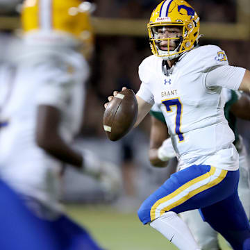 Grant quarterback Luke Alexander looks downfield for a receiver.