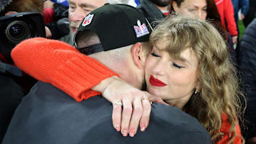 Travis Kelce #87 of the Kansas City Chiefs celebrates with Taylor Swift after a 17-10 victory against the Baltimore Ravens in the AFC Championship