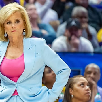 LSU coach Kim Mulkey watches as the defending national champion Tigers hold on for a win against Rice.