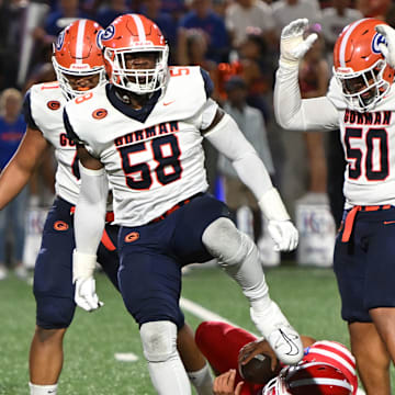 Bishop Gorman defensive tackle James Carrington celebrates after sacking Mater Dei quarterback Ashton Beierly in last week's 31-15 loss, breaking the Gaels' 27-game win streak. 