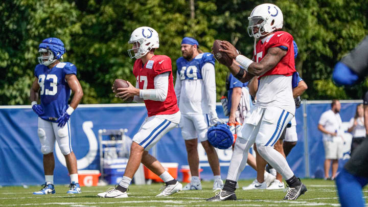 From left, Indianapolis Colts quarterback Kedon Slovis (17) and Indianapolis Colts quarterback Anthony Richardson (5) throws passes during drill for Colts Camp at Grand Park on Sunday, August. 4, 2024, in Westfield Ind.