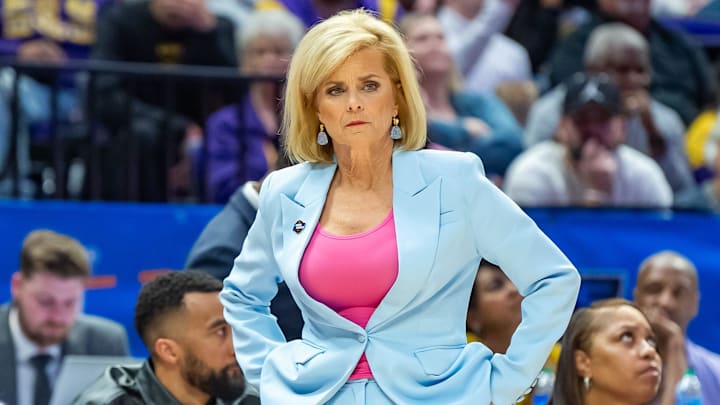 LSU coach Kim Mulkey watches as the defending national champion Tigers hold on for a win against Rice.