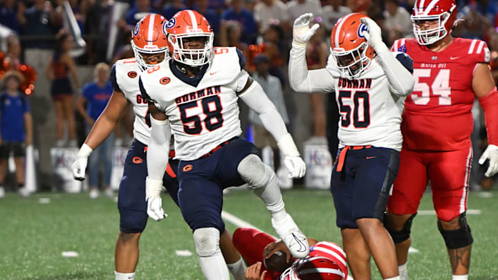 Bishop Gorman defensive tackle James Carrington celebrates after sacking Mater Dei quarterback Ashton Beierly in last week's 31-15 loss, breaking the Gaels' 27-game win streak. 