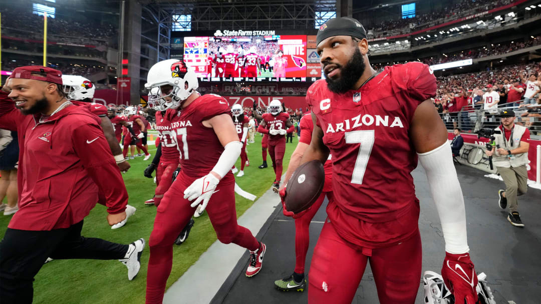 Arizona Cardinals linebacker Kyzir White (7) holds onto the ball after intercepting a Dallas Cowboys pass in the end zone in the second half at State Farm Stadium in Glendale on Sept. 24, 2023.