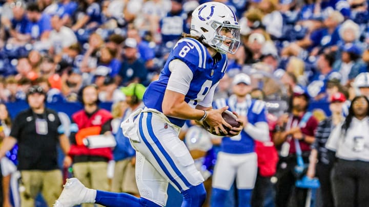 Indianapolis Colts QB Jason Bean (8) scrambles with the ball during a pre-season game between the Indianapolis Colts and the Denver Broncos on Sunday, August. 11, 2024 at Lucas Oil Stadium in Indianapolis.