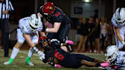 Chaparral Firebirds junior wide receiver Plas Johnson (6) is brought down by the Pinnacle defense at Chaparral High School   s football field in Scottsdale on Oct. 14, 2022.
