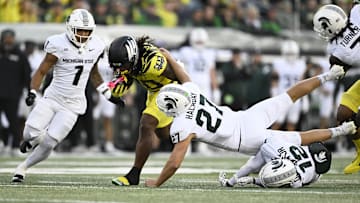 Oct 4, 2024; Eugene, Oregon, USA; Oregon Ducks running back Jordan James (20) picks up a first down during the first half against Michigan State Spartans linebacker Cal Haladay (27) at Autzen Stadium. Mandatory Credit: Troy Wayrynen-Imagn Images