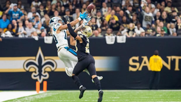 New Orleans Saints cornerback Marshon Lattimore breaks up a pass against the Carolina Panthers 