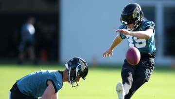 With Jacksonville Jaguars punter Logan Cooke (9) as his holder, Jacksonville Jaguars place kicker Cam Little (39) works on his field goal kicking during the fourth day of the NFL football training camp practice session Saturday, July 27, 2024 at EverBank Stadium's Miller Electric Center in Jacksonville, Fla.. [Bob Self/Florida Times-Union]
