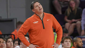 Feb 26, 2025; Clemson, South Carolina, USA; Clemson Head Coach Brad Brownell looks at a replay of his players against Notre Dame during the first half at Littlejohn Coliseum. 