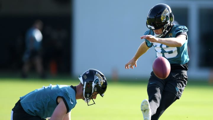 With Jacksonville Jaguars punter Logan Cooke (9) as his holder, Jacksonville Jaguars place kicker Cam Little (39) works on his field goal kicking during the fourth day of the NFL football training camp practice session Saturday, July 27, 2024 at EverBank Stadium's Miller Electric Center in Jacksonville, Fla.. [Bob Self/Florida Times-Union]