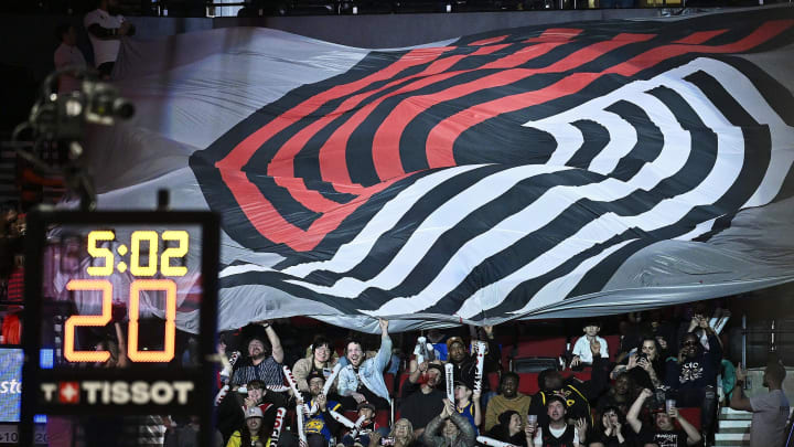 Apr 11, 2024; Portland, Oregon, USA; Portland Trail Blazers basketball fans celebrate during the second half against the Golden State Warriors at Moda Center. Mandatory Credit: Troy Wayrynen-USA TODAY Sports