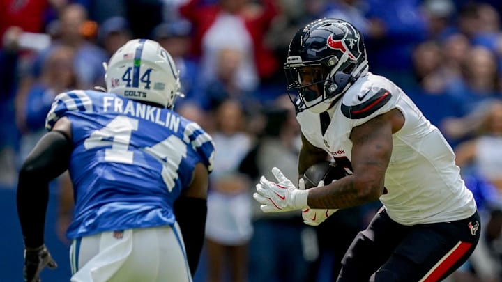 Indianapolis Colts linebacker Zaire Franklin (44) looks to bring down Houston Texans tight end Brevin Jordan (9) on Sunday, Sept. 8, 2024, during a game against the Houston Texans at Lucas Oil Stadium in Indianapolis.