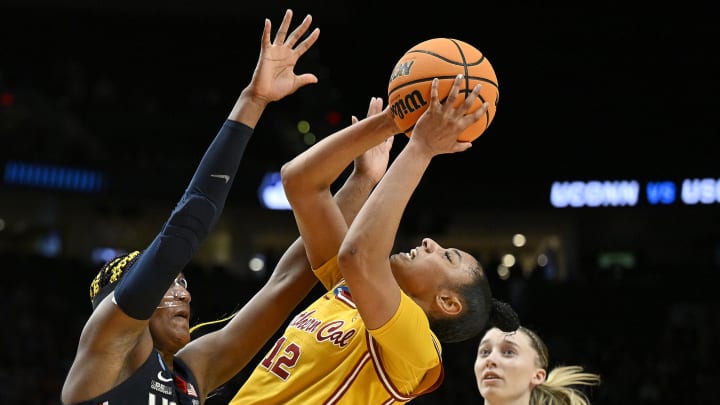 Apr 1, 2024; Portland, OR, USA; USC Trojans guard JuJu Watkins (12) puts up a shot against the UConn Huskies in the Elite Eight round of the NCAA Tournament.