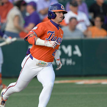 Mar 14, 2025; Clemson, South Carolina, USA; Clemson graduate Tristan Bissetta (27) rounds first base during the bottom of the sixth inning at Doug Kingsmore Stadium. Mandatory Credit: Ken Ruinard/USA Today Network via Imagn Images