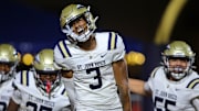 St. John Bosco (Calif.) receiver Daniel Odom shows emotion while taking the field with his teammates before facing Chaminade-Madonna in the season opener in Florida. 
