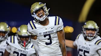 St. John Bosco (Calif.) receiver Daniel Odom shows emotion while taking the field with his teammates before facing Chaminade-Madonna in the season opener in Florida. 