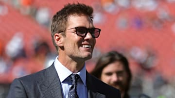 NFL legend Tom Brady is all smiles before an NFL football game at Huntington Bank Field, Sunday, Sept. 8, 2024, in Cleveland, Ohio.