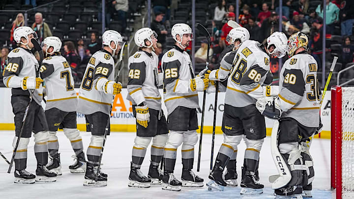 Henderson Silver Knights players line up to celebrate a win with goalie Carl Lindbom after their game at Acrisure Arena in Palm Desert, Calif., Wednesday, April 8, 2026.