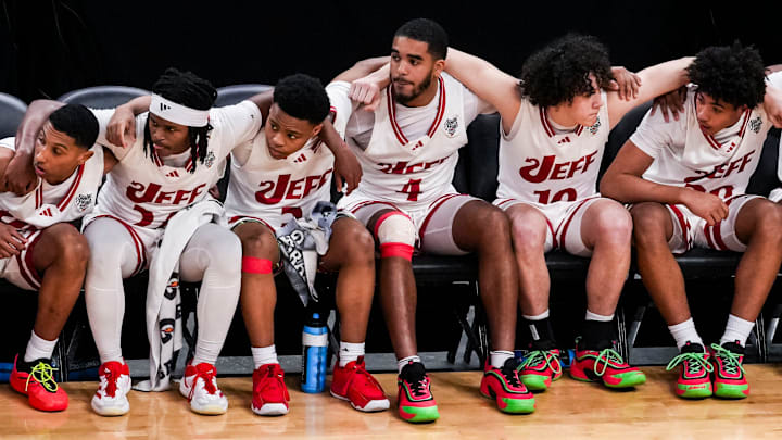 The Jeffersonville Red Devils prepare to rush the court Saturday, March 29, 2025, during the IHSAA Class 4A boys basketball state championship game in Indianapolis. The Jeffersonville Red Devils prepare to rush the court Saturday, March 29, 2025, during the IHSAA Class 4A boys basketball state championship game in Indianapolis.